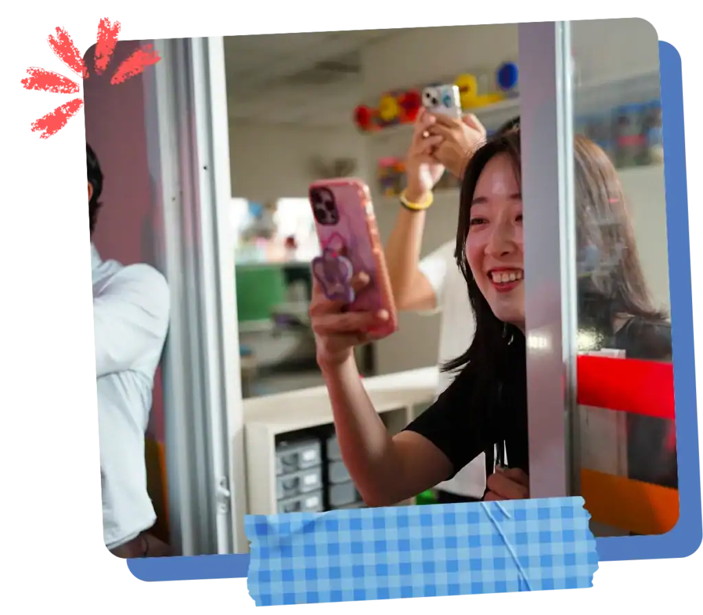 A CPC parent warmly interacting with a young child at the classroom doorway